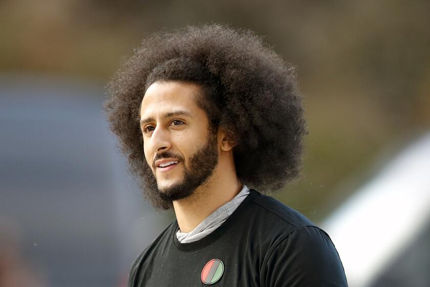FILE - In this Nov. 16, 2019, file photo, free agent quarterback Colin Kaepernick arrives for a workout for NFL football scouts and media in Riverdale, Ga. Kaepernick’s publishing company is putting out a collection of 30 essays over the next four weeks about abolition, police and prisons. The project is titled: “Abolition For the People: The Movement For A Future Without Policing & Prisons.” Kaepernick envisioned and curated this project following the deaths of George Floyd and Breonna Taylor. (AP Photo/Todd Kirkland, File)