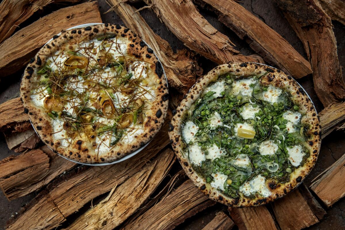 Asparagus pizza, left, and English pea pizza.