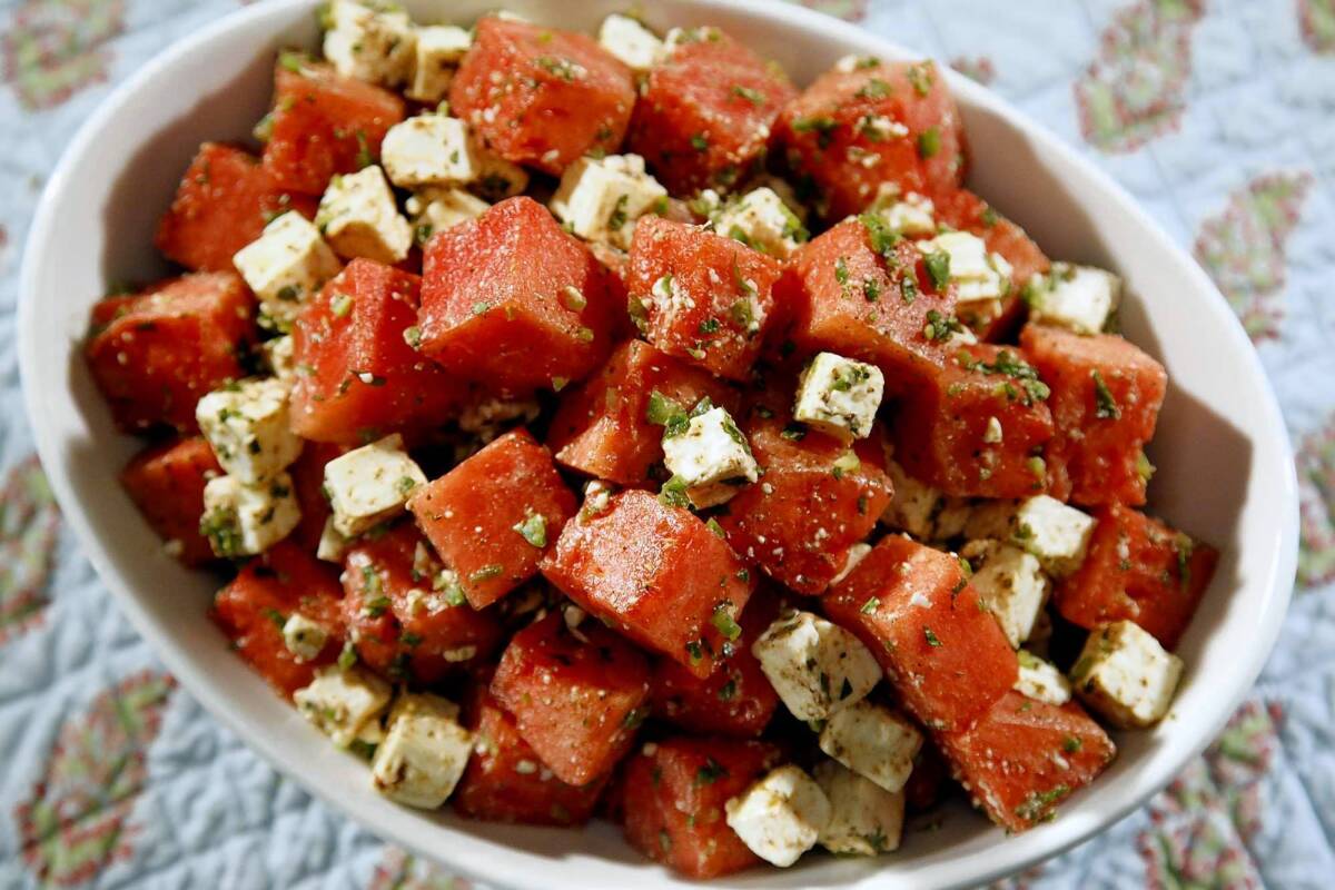 Cubed watermelon is combined with feta, mint, a little jalapeno and a cumin-lime dressing. Recipe: Watermelon salad with feta, mint and cumin-lime dressing.
