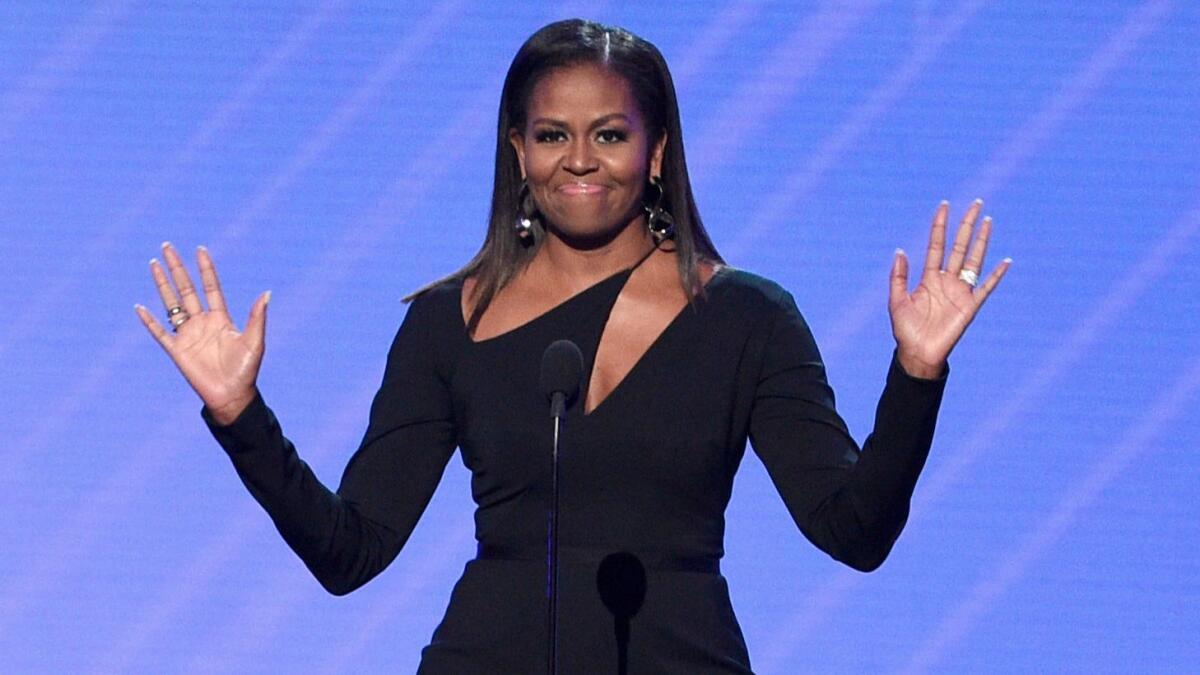 Former First Lady Michelle Obama presents the Arthur Ashe Courage Award at the ESPYs on Wednesday.