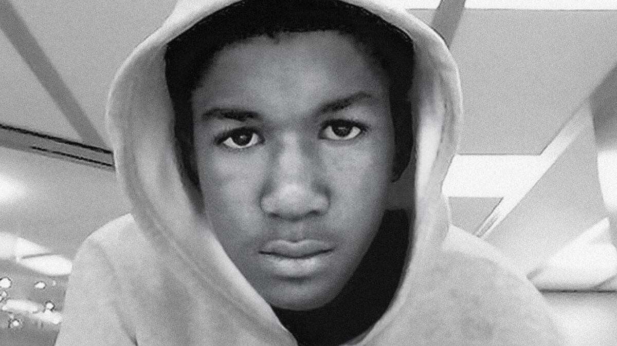 A photo of a young man wearing a hoodie