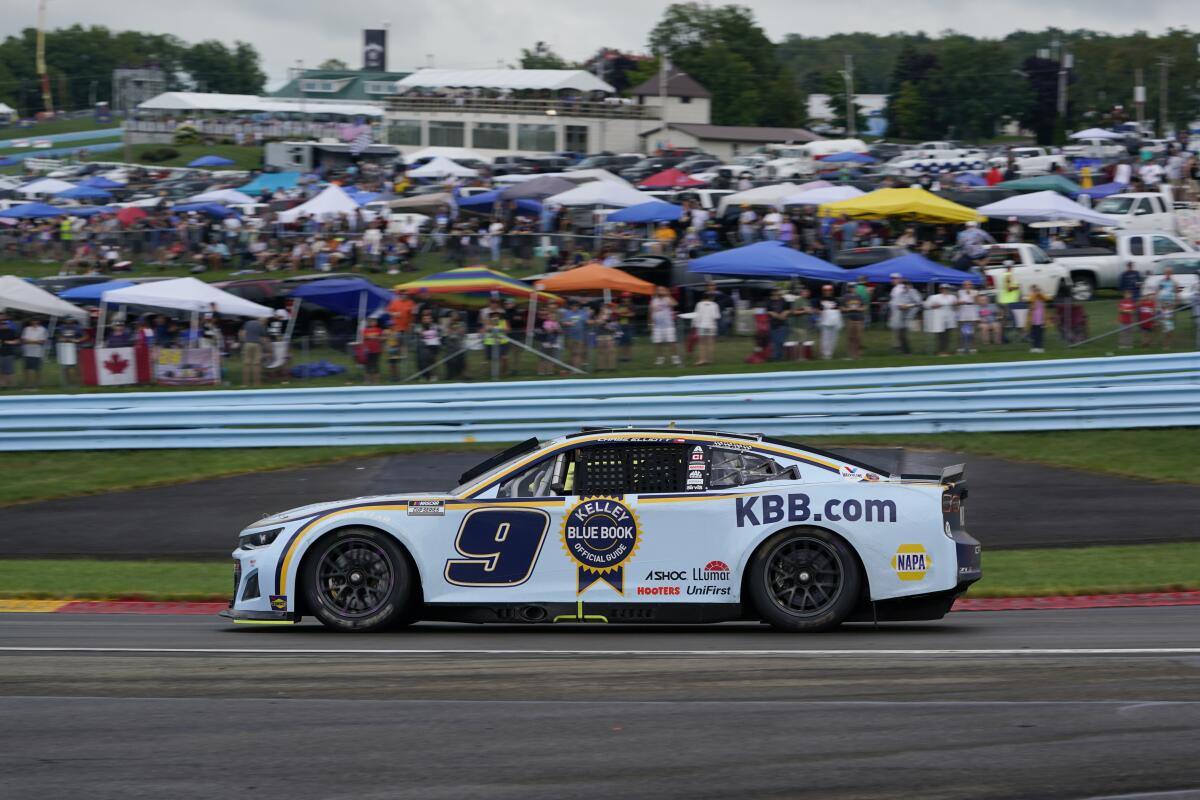 Chase Elliott drives around the first turn during a NASCAR Cup Series auto race in Watkins Glen, N.Y., Sunday, Aug. 21, 2022. (AP Photo/Seth Wenig)