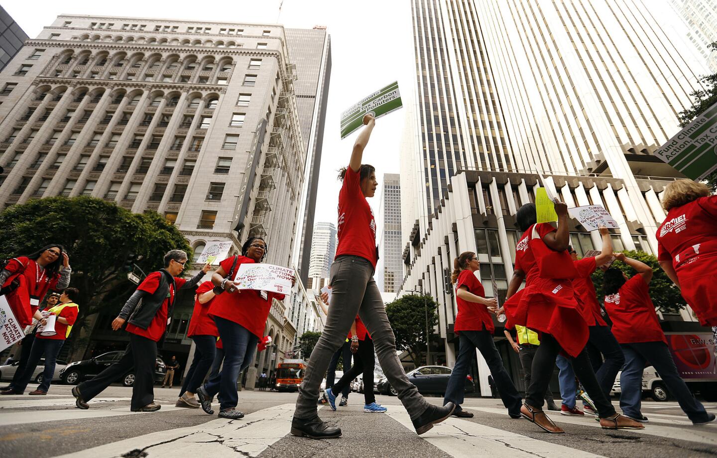Hundreds of nurses and environmental activists march in downtown Los Angeles on Thursday to demand a global agreement on greenhouse gases.