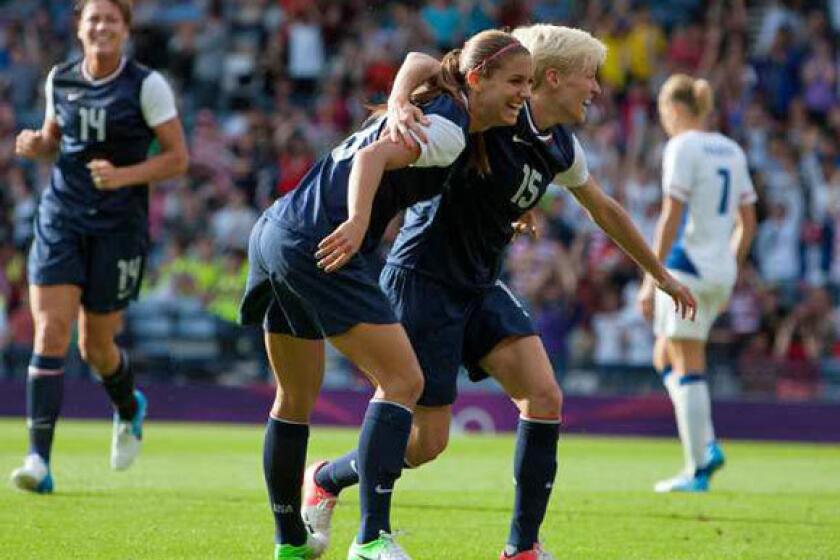 United States' Megan Rapinoe, right and Alex Morgan celebrate together after Morgan scores her second goal.