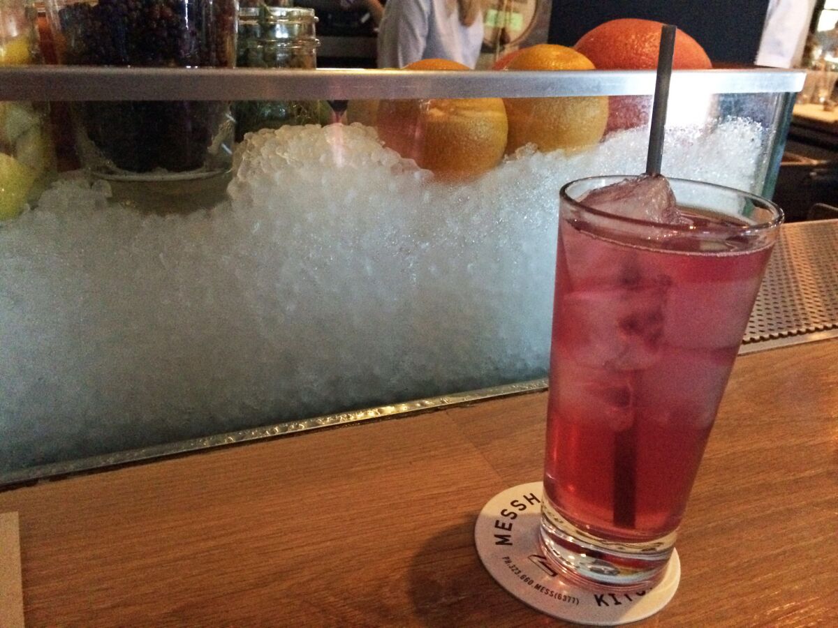 A sour cherry-almond vodka soda cocktail from Messhall.