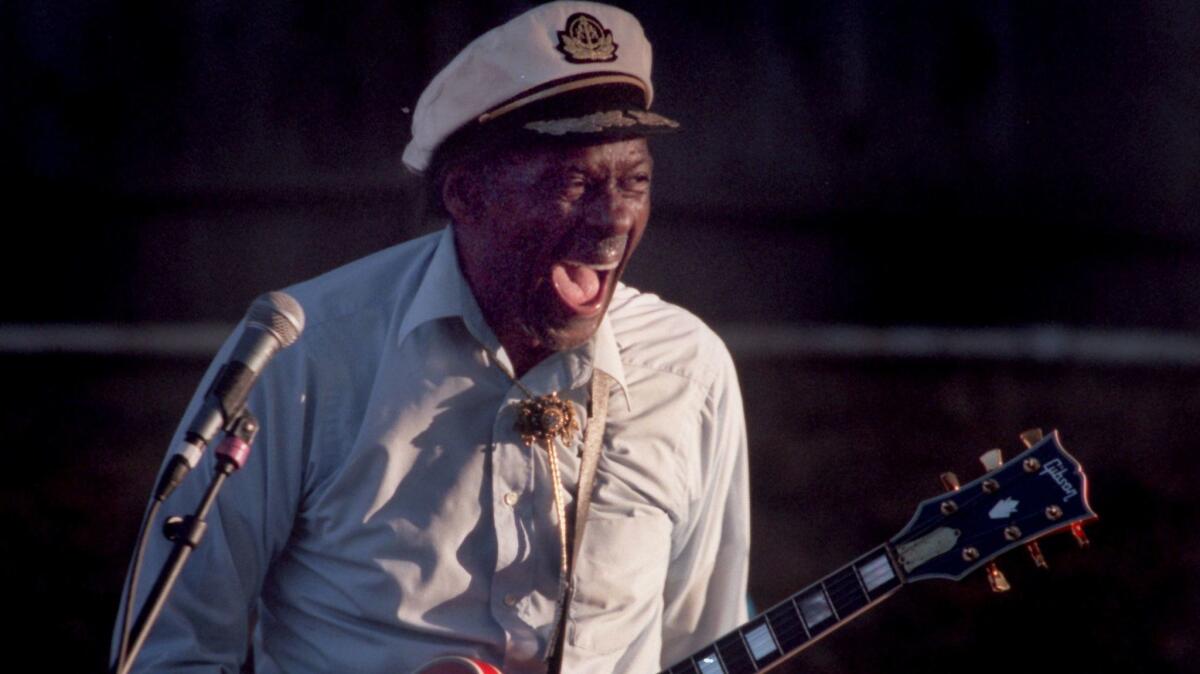 Chuck Berry, shown performing in Orange County in 1997, could be aloof or sweetly endearing up close and personal, writes longtime Times pop music writer Randy Lewis.