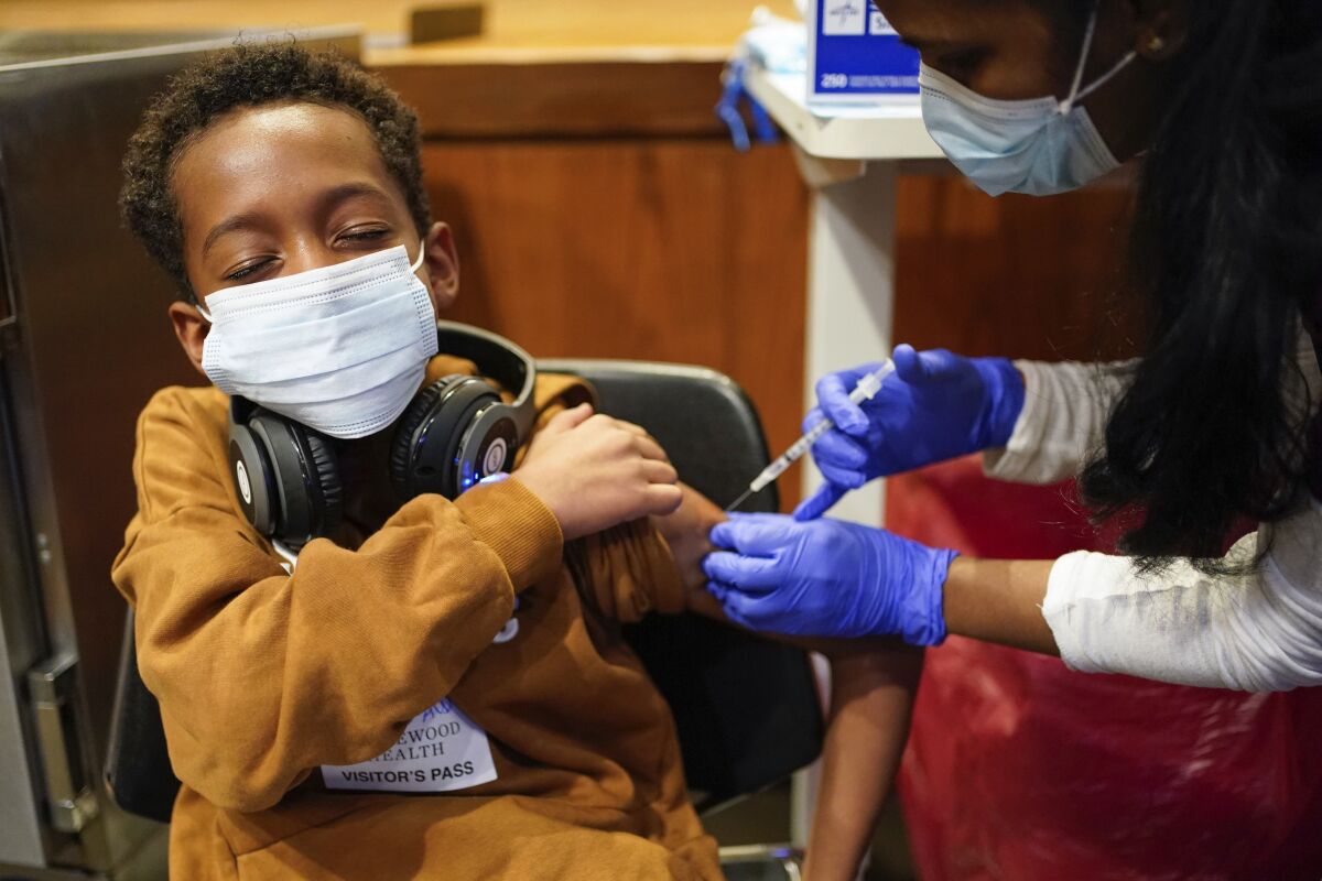  Cameron West, 9, receives a COVID-19 vaccination at Englewood Health in Englewood, N.J.