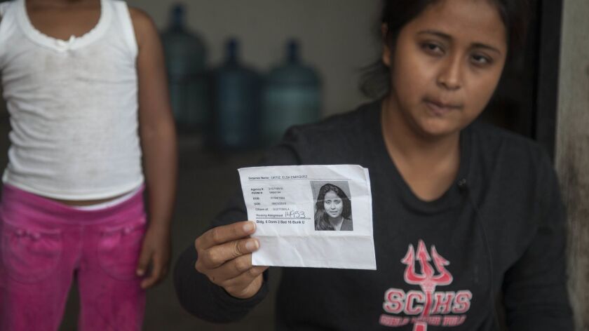 Elsa Johana Ortiz, 25, shows a document from U.S. immigration authorities as she gives an interview about how U.S. immigration authorities separated her from her 8-year-old son Antony Daniel Tobar Ortiz in Texas and deported her to her home country, at her home in Guatemala,
