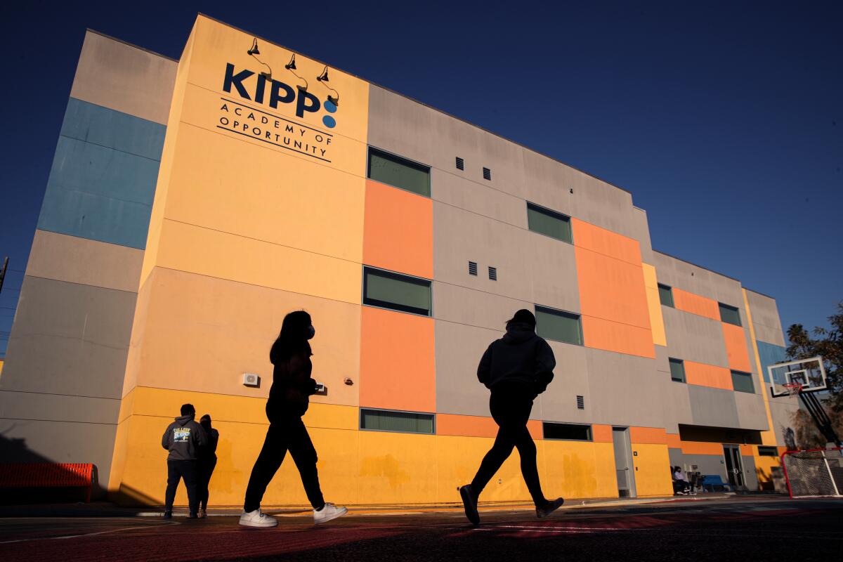 The silhouettes of KIPP Academy of Opportunity middle-schoolers in the play garden.