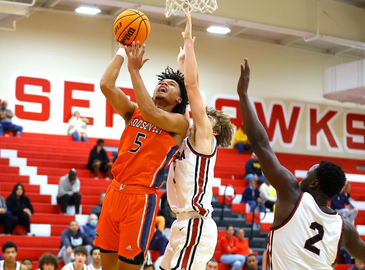 Brayden Burries of Eastvale Roosevelt goes up for shot against JSerra at Redondo Union.