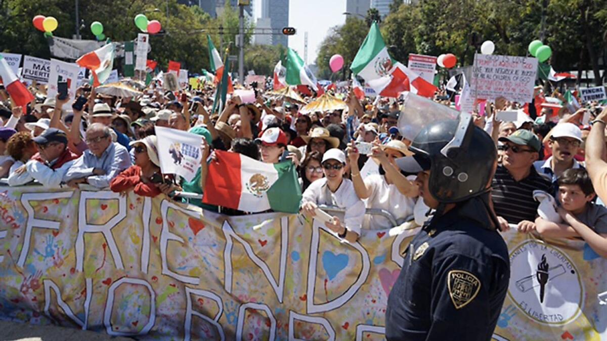 Demonstrators march along Paseo de la Reforma in Mexico City on Feb. 12, 2017, protesting the immigration and trade policies of President Trump.