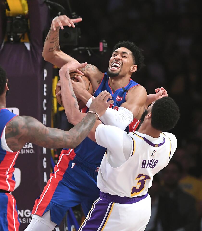 LOS ANGELES, CALIFORNIA JANUARY 5, 2020-Lakers Anthony Bradley blocks the shot of Pistons Christian Wood in the 1st quarter at the Staples Center Sunday. (Wally Skalij/Los Angerles Times)