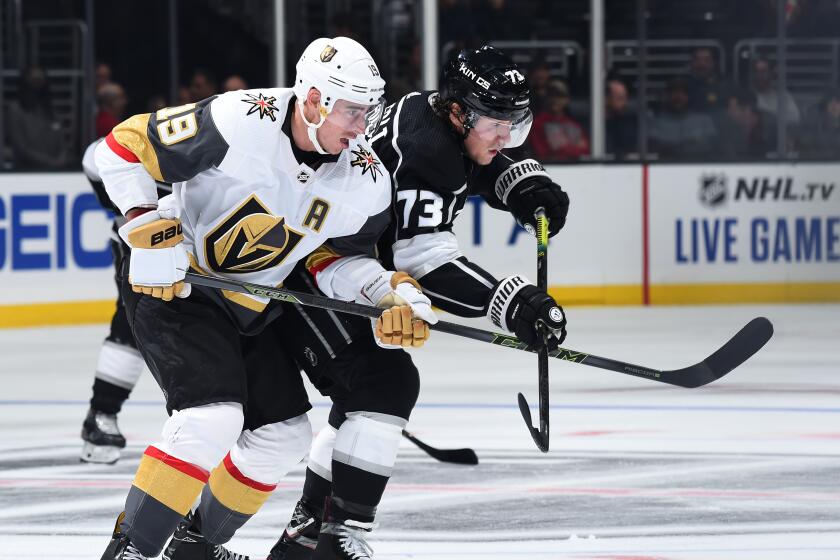 LOS ANGELES, CA - OCTOBER 13: Reilly Smith #19 of the Vegas Golden Knights and Tyler Toffoli #73 of the Los Angeles Kings battle for position during the third period of the game at STAPLES Center on October 13, 2019 in Los Angeles, California. (Photo by Juan Ocampo/NHLI via Getty Images)