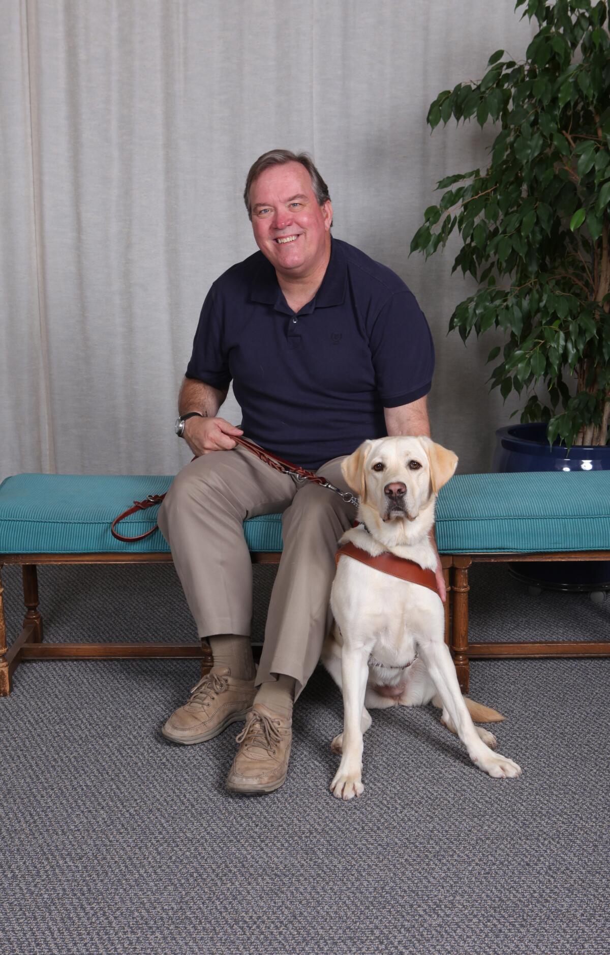Mark Carlson with his current dog, Saffy.