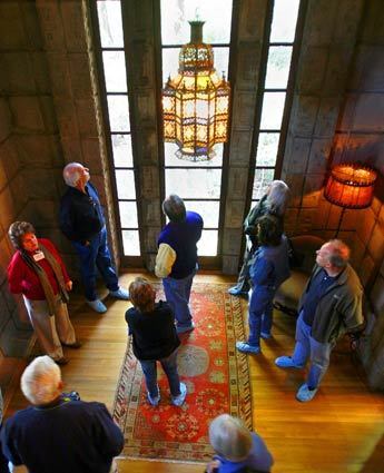 Groups of 10 toured La Miniatura. Visitors gather in the light filled master bedroom, studying up close the details of the Frank Lloyd Wright design. The privately owned house is currently unoccupied.