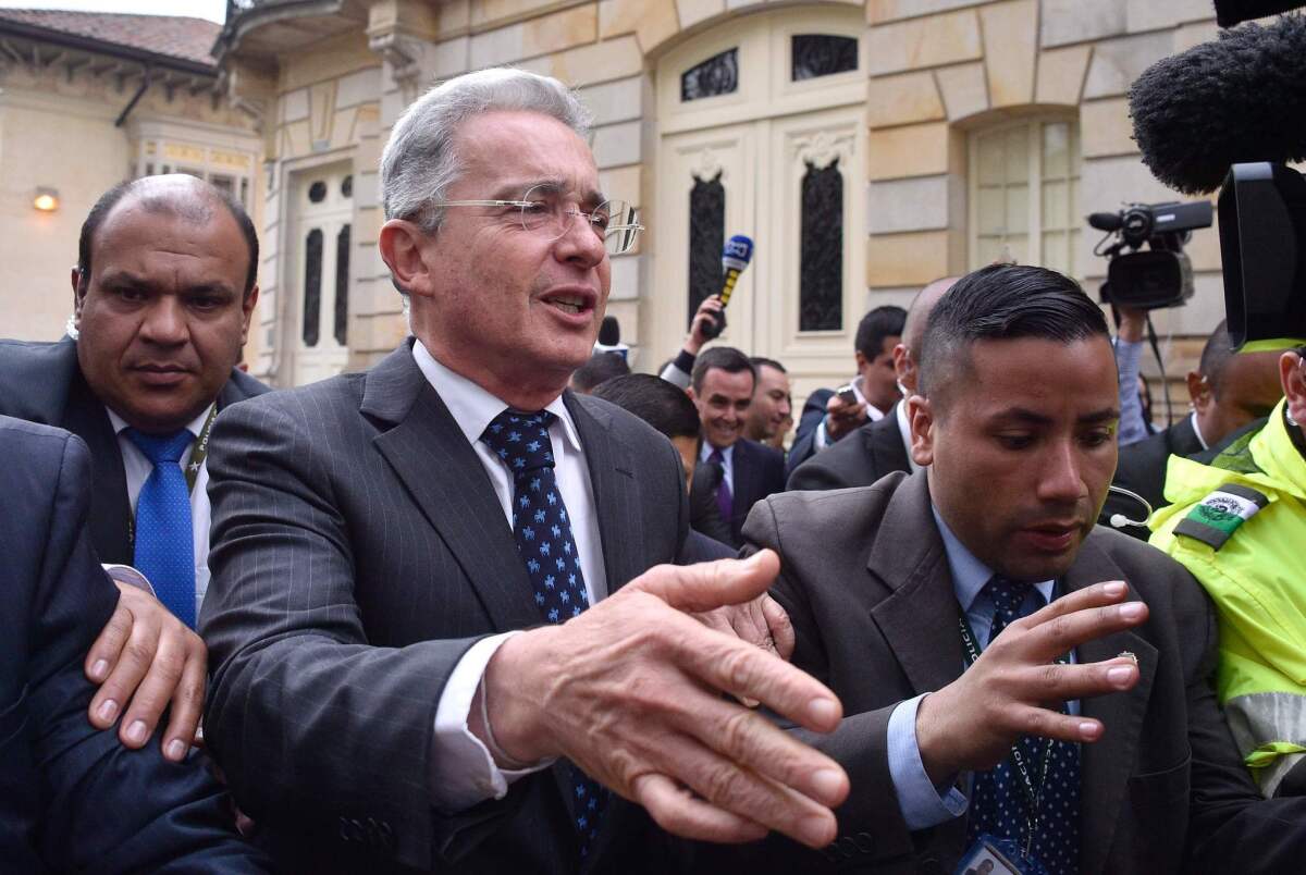 Sen. Alvaro Uribe leaves a meeting with Colombian President Juan Manuel Santos in Bogota on Oct. 5, 2016.