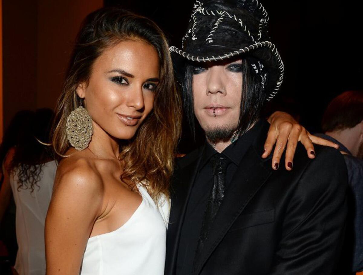 Nathalia Henao and Guns N' Roses guitarist DJ Ashba. The Las Vegas police department launched an internal investigation into the private helicopter ride for the pair, during which Ashba proposed and she said yes.