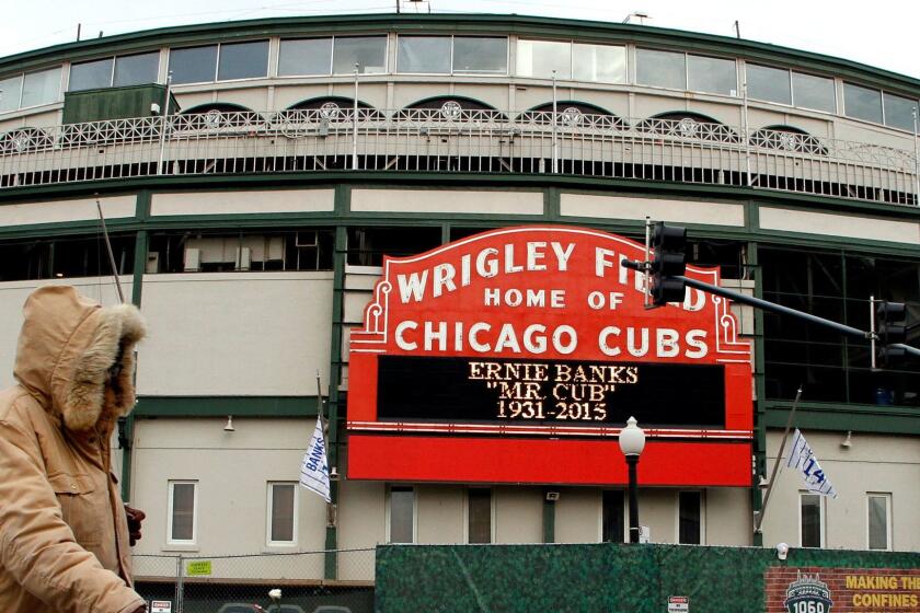 A sign displays at Wrigley Field in honor of Ernie Banks in Chicago, Saturday, Jan. 24, 2014. Chicago Cubs legend Ernie Banks has died at the age of 83. 'Mr. Cub' passed away Friday night at Northwestern Memorial Hospital in Chicago.(AP Photo/Nam Y. Huh)