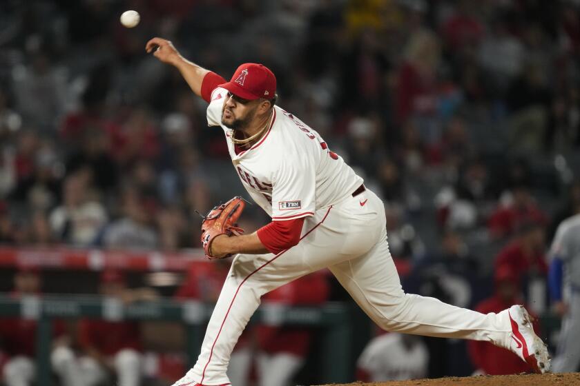 Los Angeles Angels relief pitcher Carlos Estévez throws during the ninth inning of a baseball game.