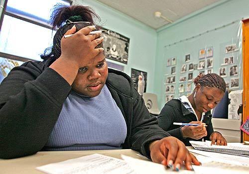 Seniors Ashley Bennett, left, and Whitney Jones study on campus after school at Duke Ellington High School Thursday in Los Angeles. Bennett is 17 years old and Jones is 18. Jones has failed the exit exam and will not be able to graduate in June after the state Supreme Court reinstated the high school test.