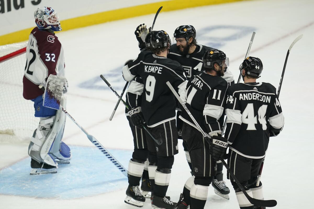 Kings forward Adrian Kempe celebrates with teammates after scoring in the third period of a 4-2 win.