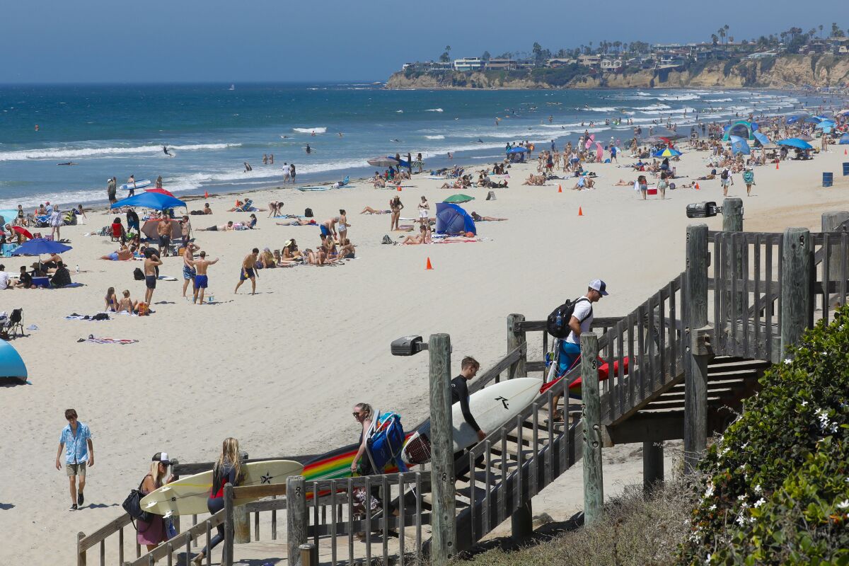 Large crowds on Saturday enjoyed the afternoon on the sand and in the water at Pacific Beach.