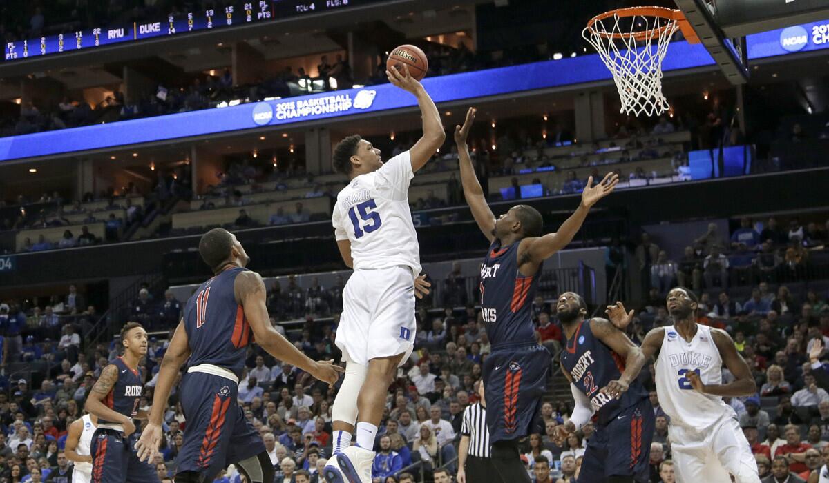 Duke's Jahlil Okafor shoots over a Robert Morris player during the first half of the NCAA tournament on Friday. The Blue Devils pulled away for an 85-56 victory.