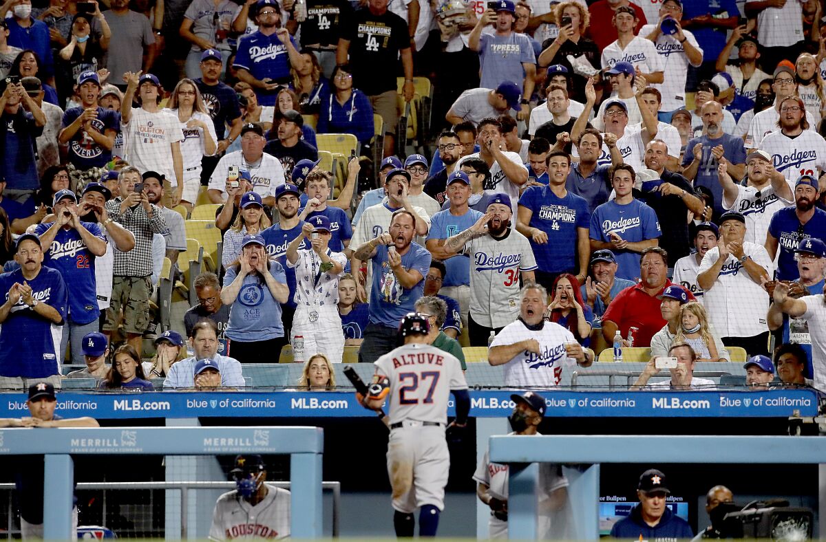 Fans boo Astros player Jose Altuve as he heads back to the dugout Aug. 3, 2021. 