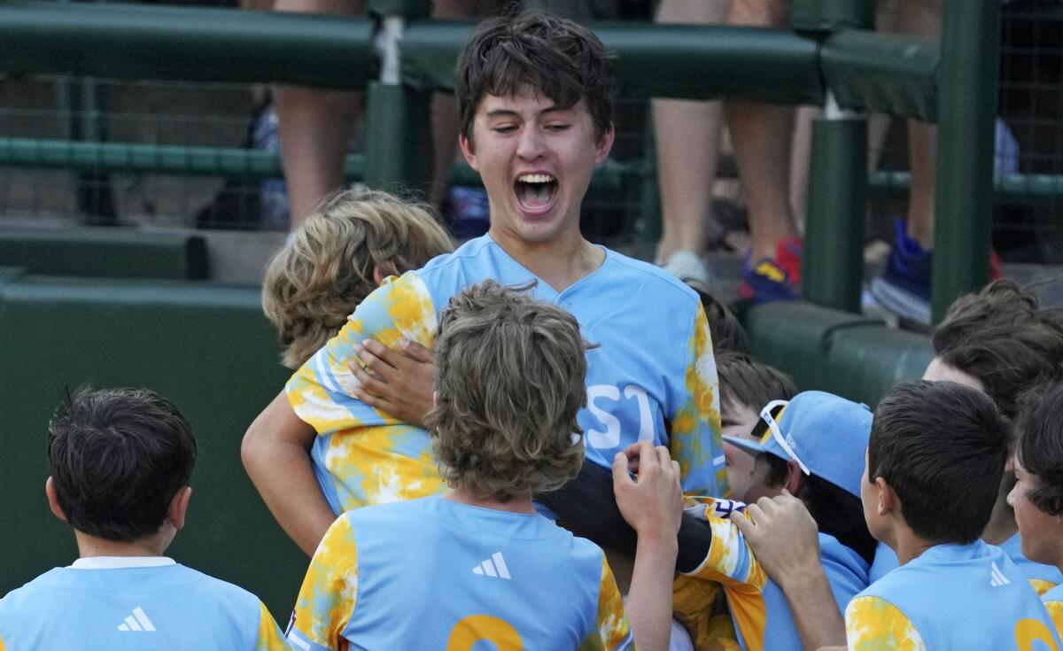 Louis Lappe celebrates with his teammates after his walk-off home run Sunday.