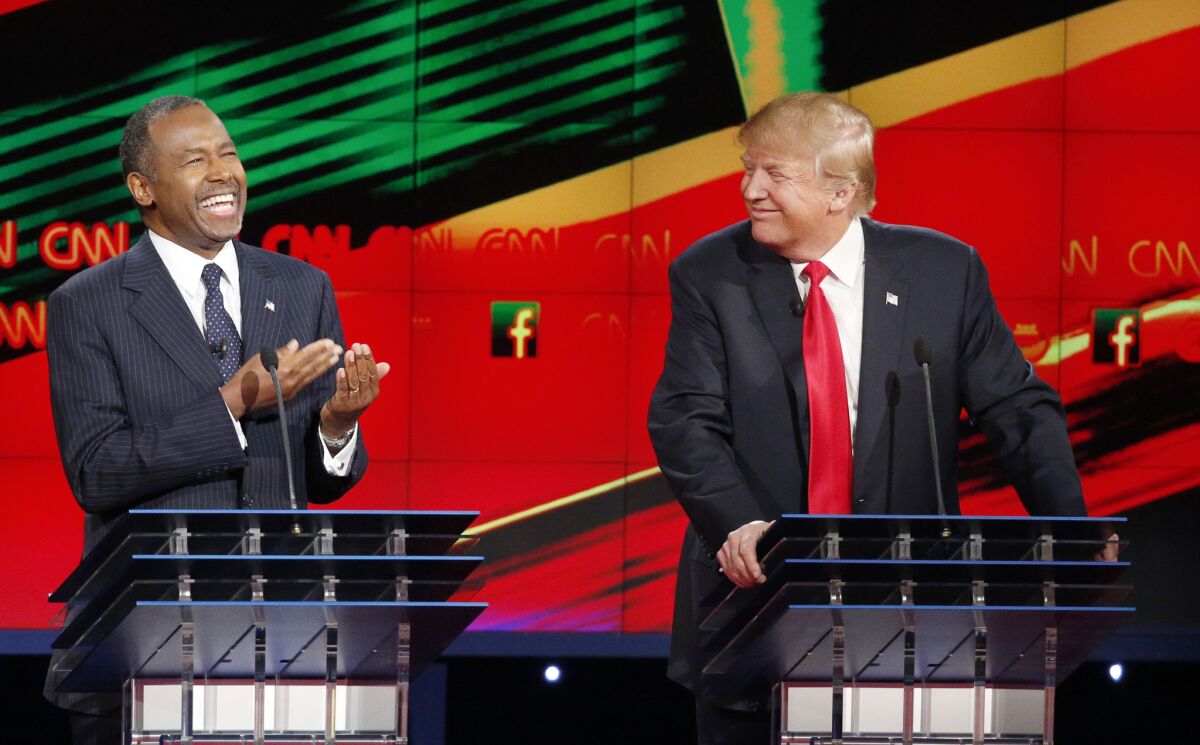 Ben Carson, left, and Donald Trump at the Republican presidential debate at the Venetian in Las Vegas.