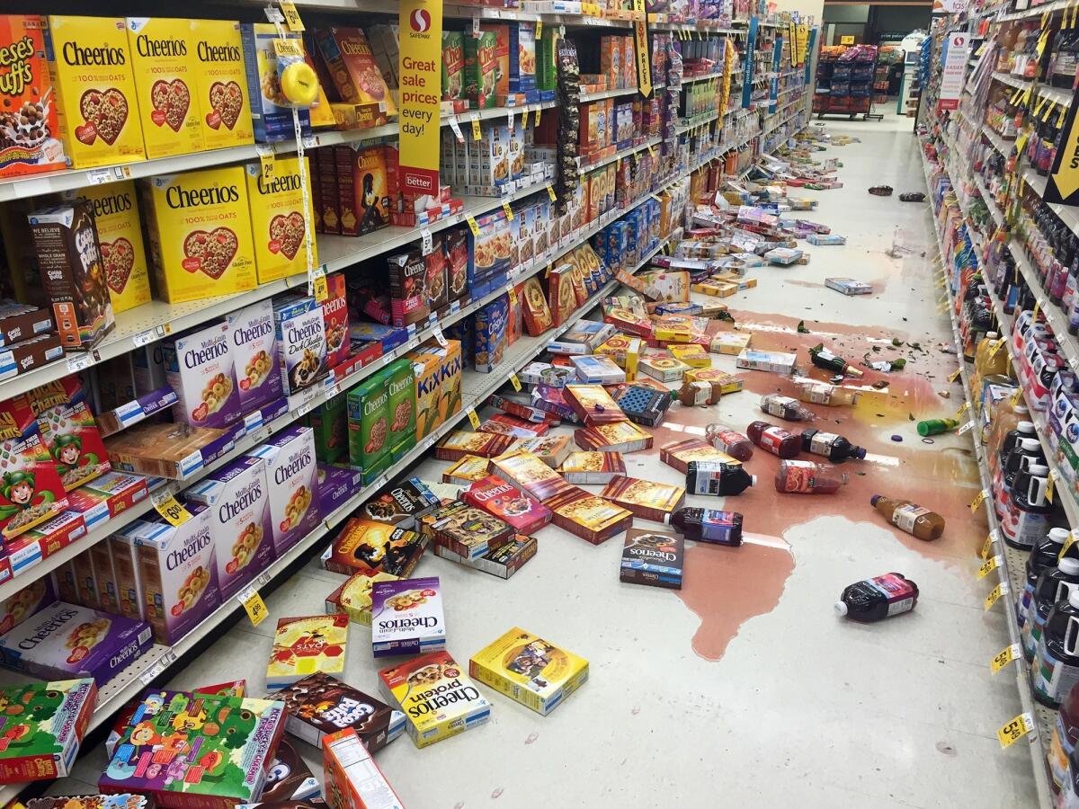 Boxes of cereal and bottles of juice lie on the floor of a Safeway store on the Kenai Peninsula after the earthquake.