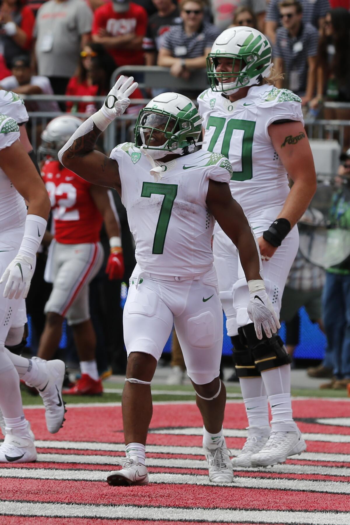 Oregon running back CJ Verdell celebrates his touchdown against Ohio State during the first half of an NCAA college football game Saturday, Sept. 11, 2021, in Columbus, Ohio. (AP Photo/Jay LaPrete)