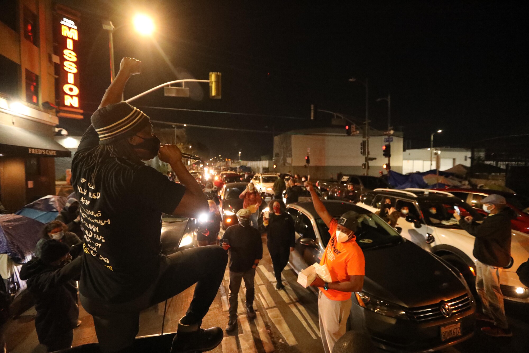 Pastor Stephen "Cue" Jn-Maria leads a chant during a "blockade'' against evangelist Christian singer Sean Feucht’s event