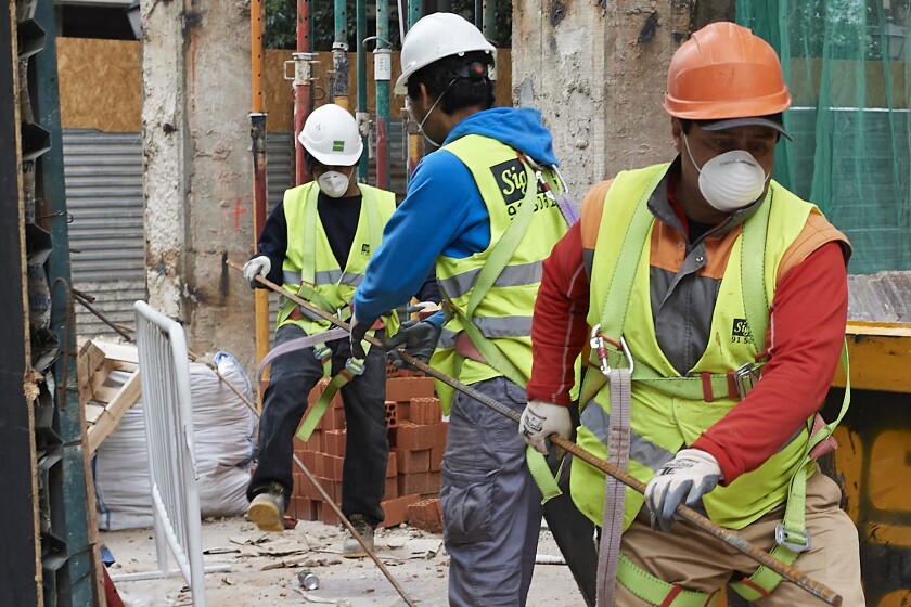 Construction workers return to work as the government eases coronavirus restrictions in Madrid.