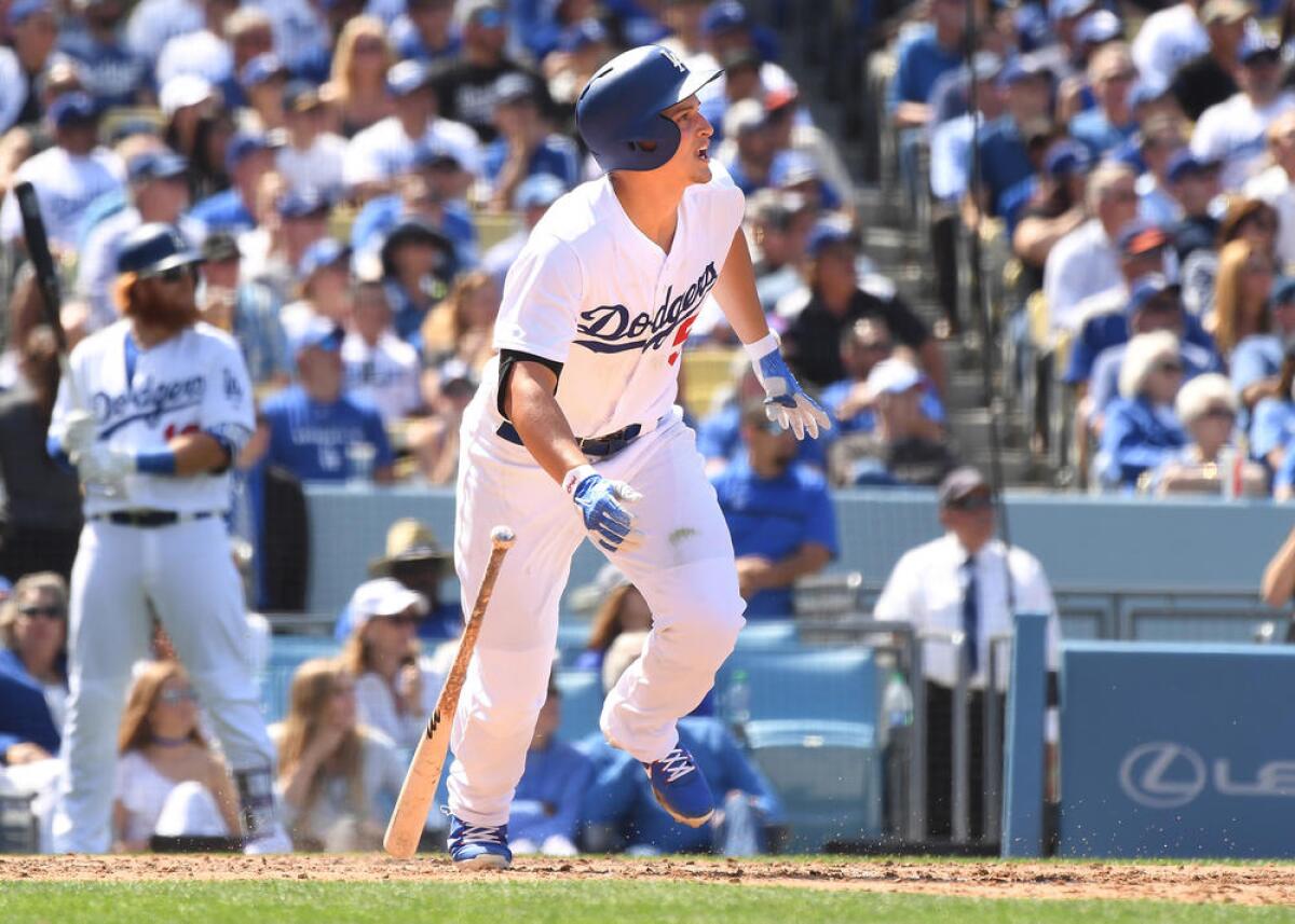 Corey Seager watches as his three-run homerun clears the left center fence.