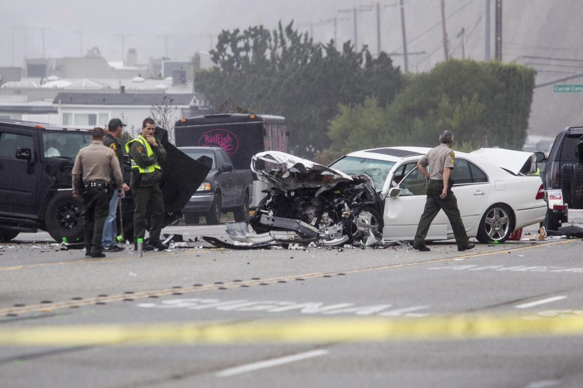 A person who was in this white car was killed and five other people were injured in the crash on Pacific Coast Highway in Malibu.