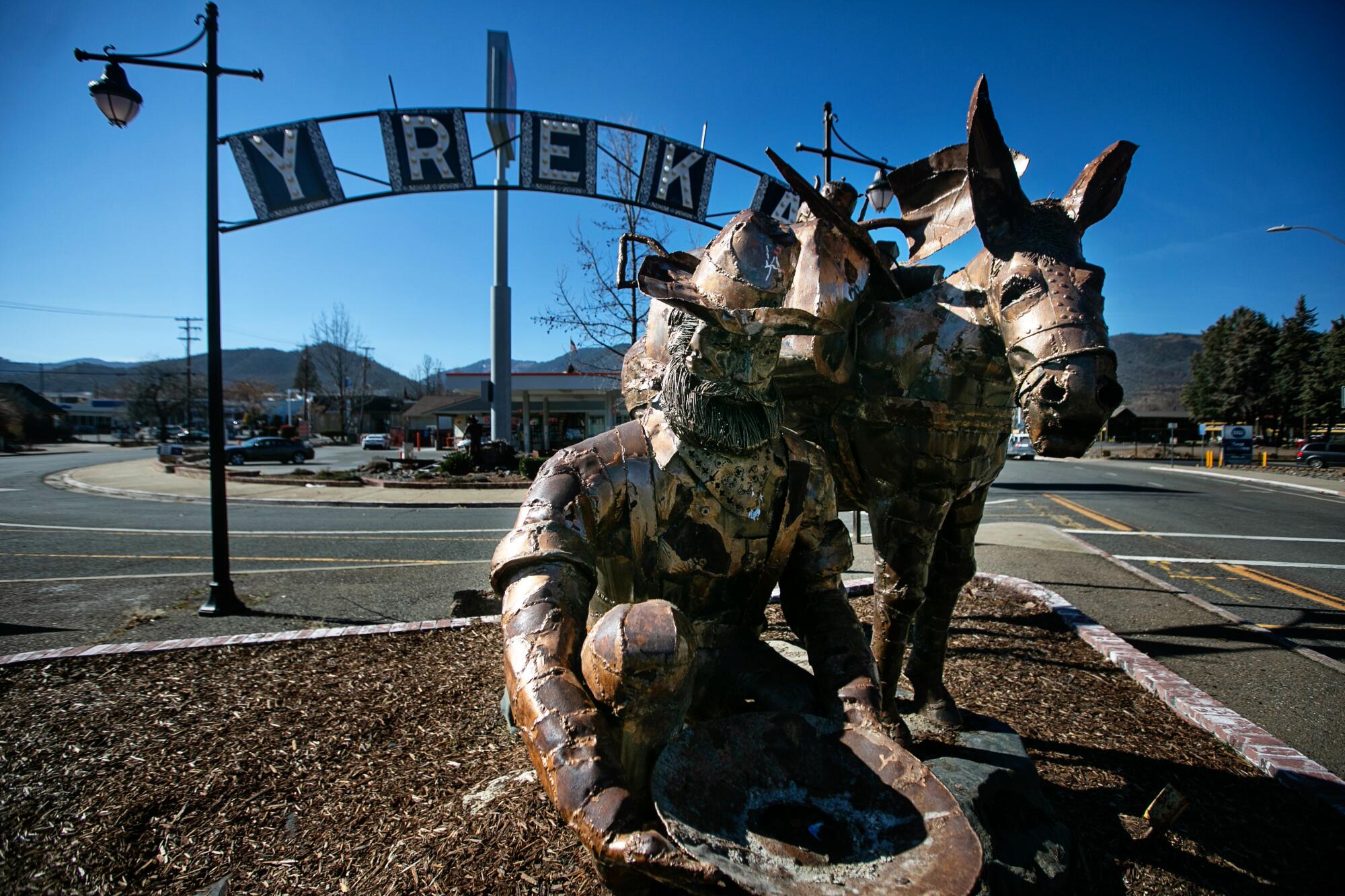 A bearded prospector panning for gold and his pack mule greet visitors to Yreka.