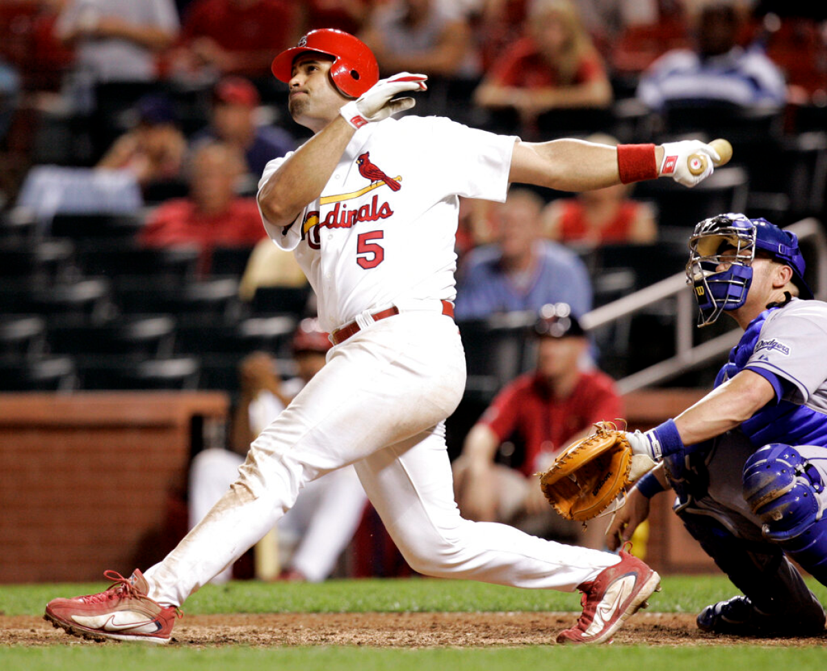 St. Louis Cardinals slugger Albert Pujols connects for a home run in the 14th inning against the Dodgers on July 13, 2006.