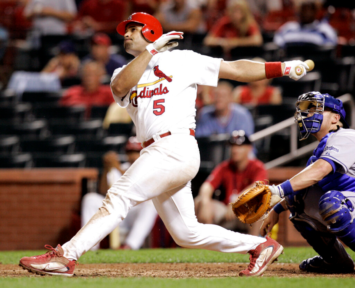 St. Louis Cardinals slugger Albert Pujols hits a walk-off home run in the 14th inning against the Dodgers on July 13, 2006.