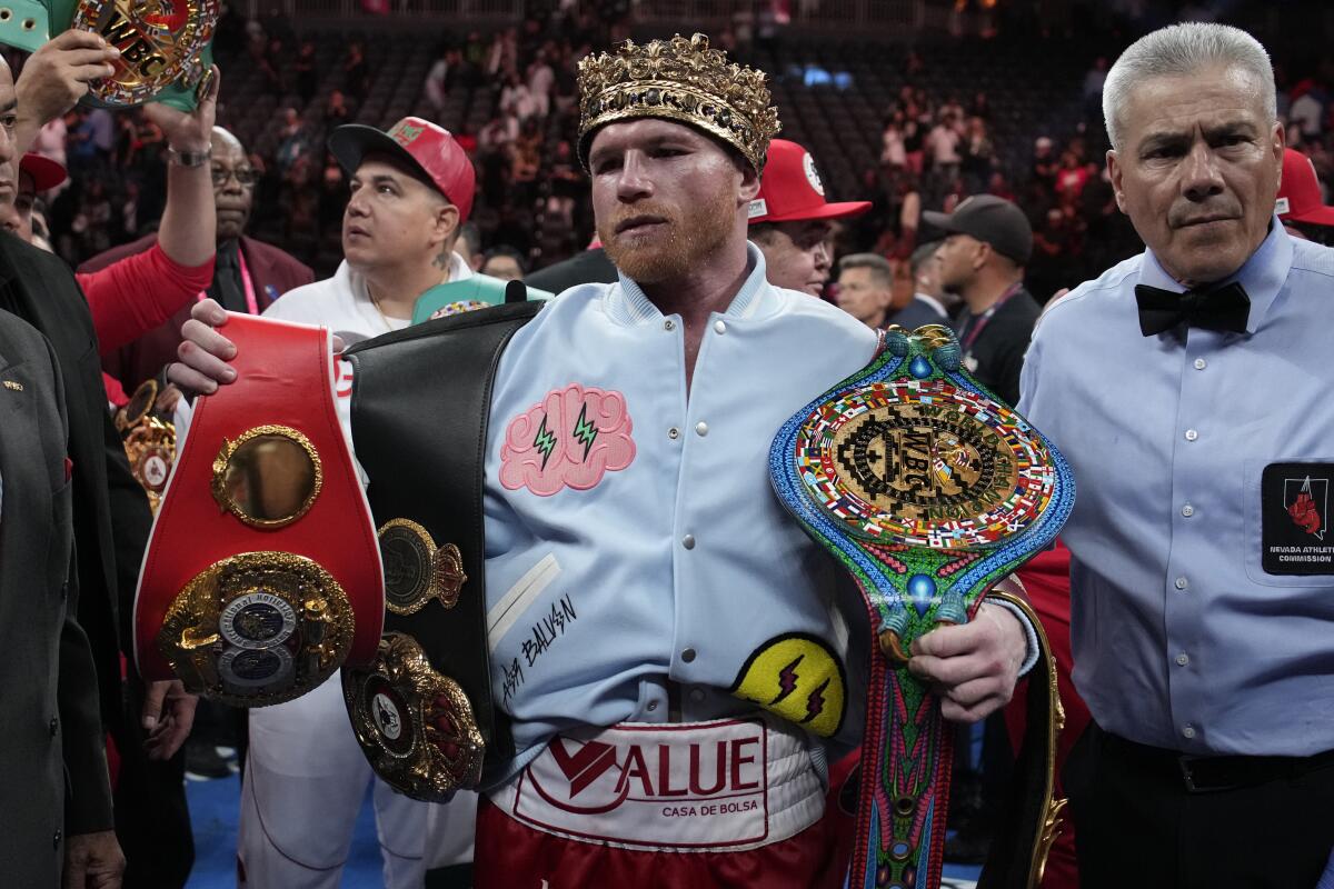 Canelo Álvarez celebrates after defeating Gennadiy Golovkin in their super middleweight title fight.