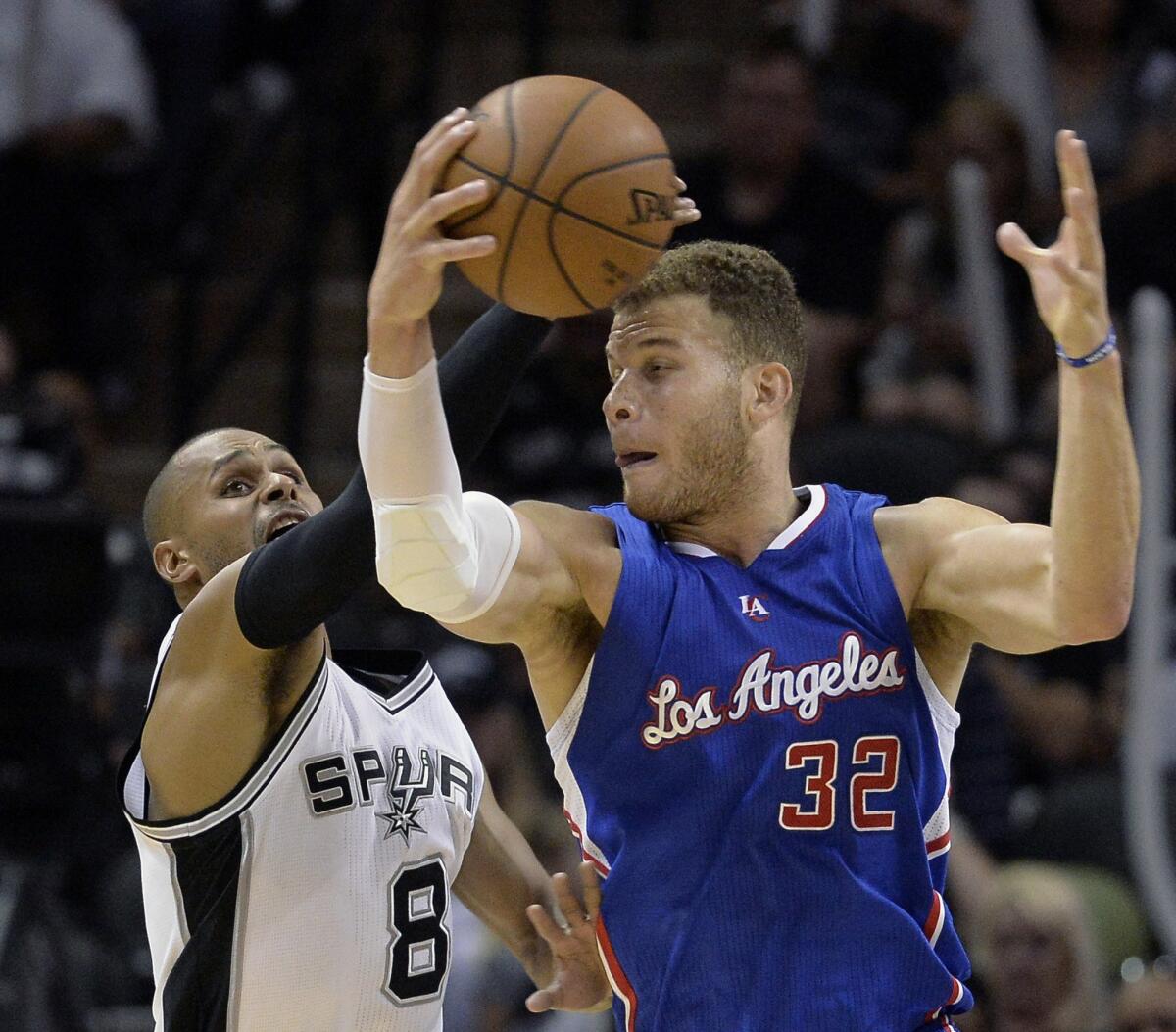 Clippers forward Blake Griffin receives a pass in the post against Spurs guard Patty Mills in the second half of Game 4.