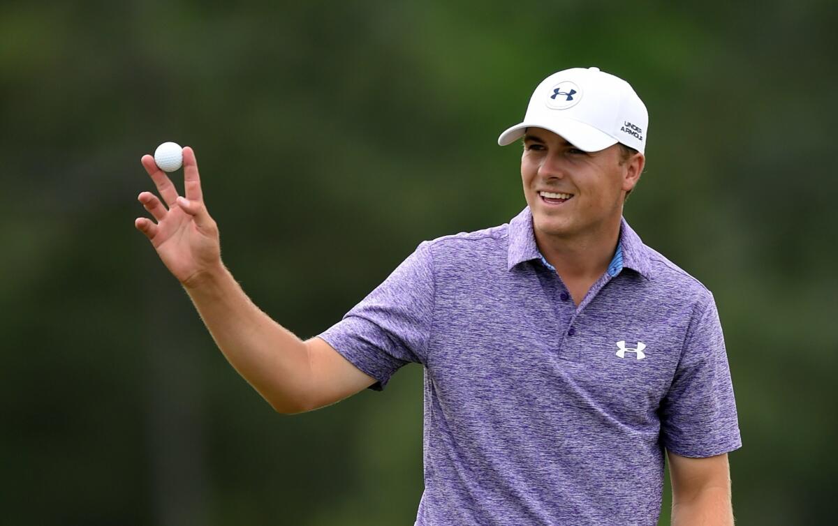 Jordan Spieth waves to the crowd at the 18th hole Friday during Round 2 of the Masters at Augusta National.