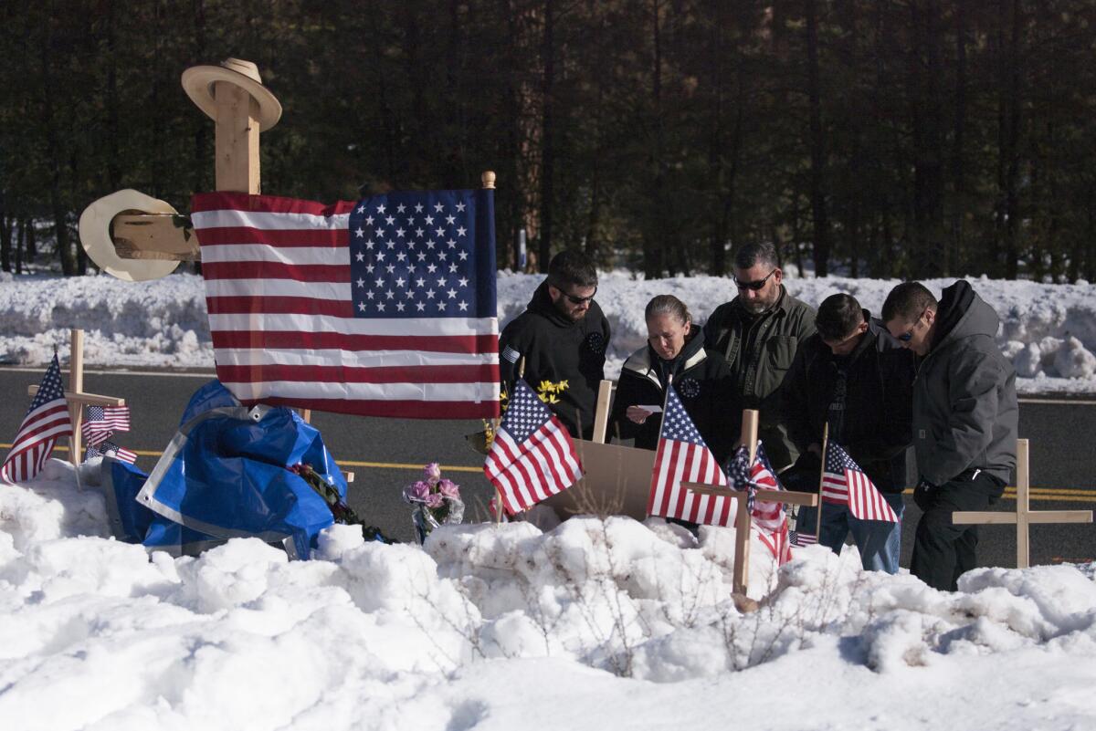 Members of the Idaho Three Percenters patriot group gather Jan. 31 at the site where Robert "LaVoy" Finicum was shot and killed by federal agents.