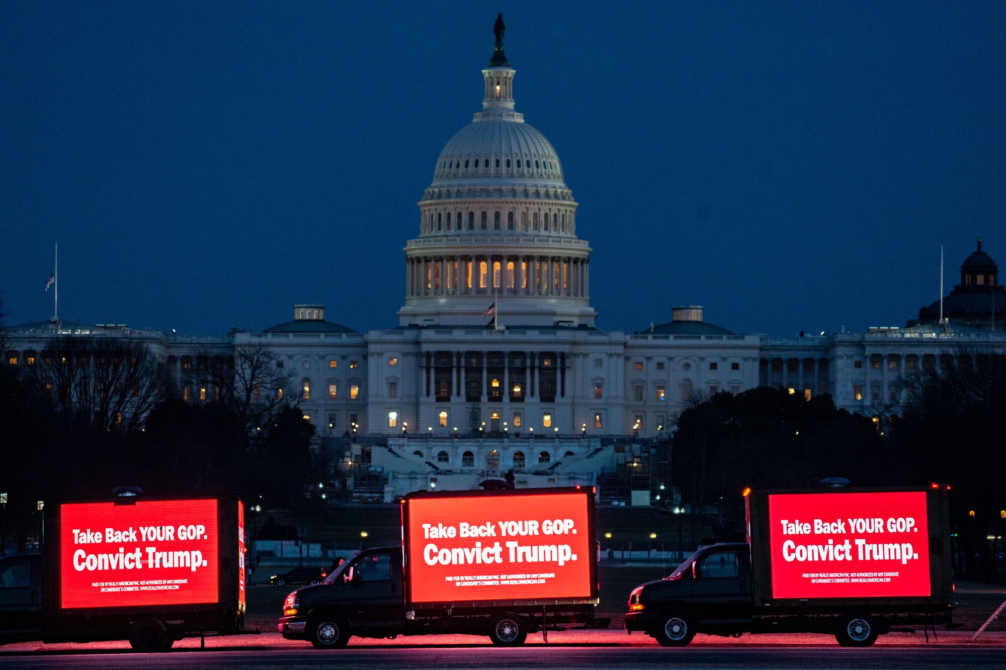 Trucks with LED screens displaying anti-Trump messages near the Capitol Building