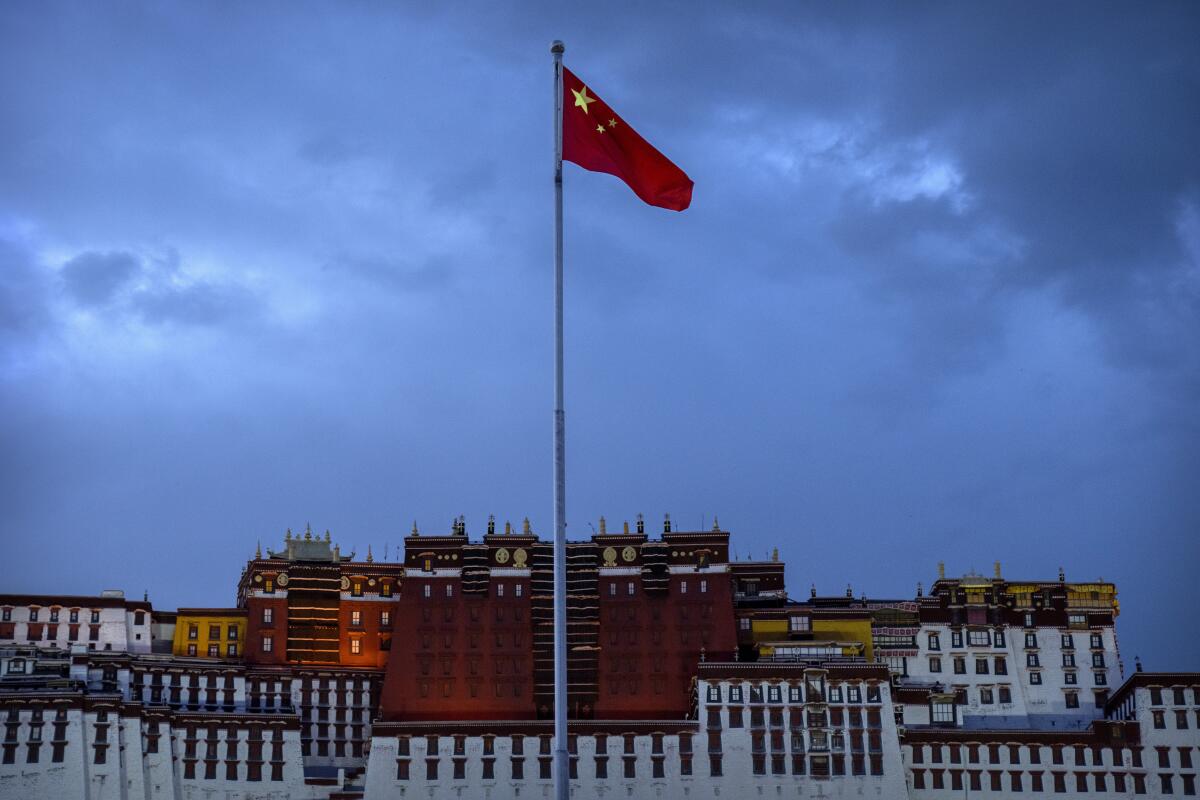 The Chinese flag flies near the Potala Palace in Lhasa in western China's Tibet Autonomous Region.