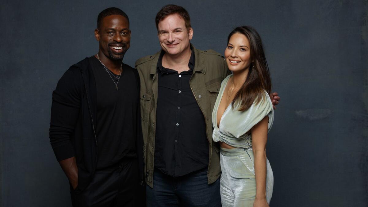 Sterling K. Brown, Shane Black and Olivia Munn from the film "The Predator" are photographed at Comic-Con 2018 in San Diego in July. Munn learned in August that Steven Wilder Striegel is a registered sex offender.