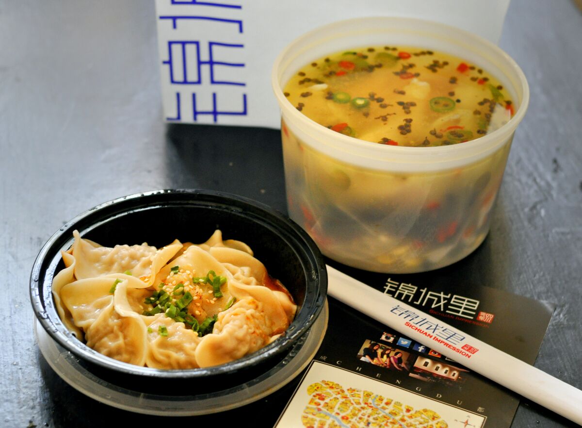 A takeout order of boiled fish with rattan pepper and dumplings from Sichuan Impression in Alhambra. 