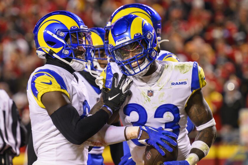 Los Angeles Rams safety Nick Scott (33) celebrates with teammates after making an interception.