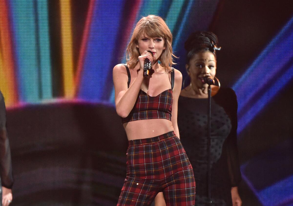 Taylor Swift turned 25 on Saturday and celebrated with a massive party in her New York apartment after performing, above, at Z100's Jingle Ball.