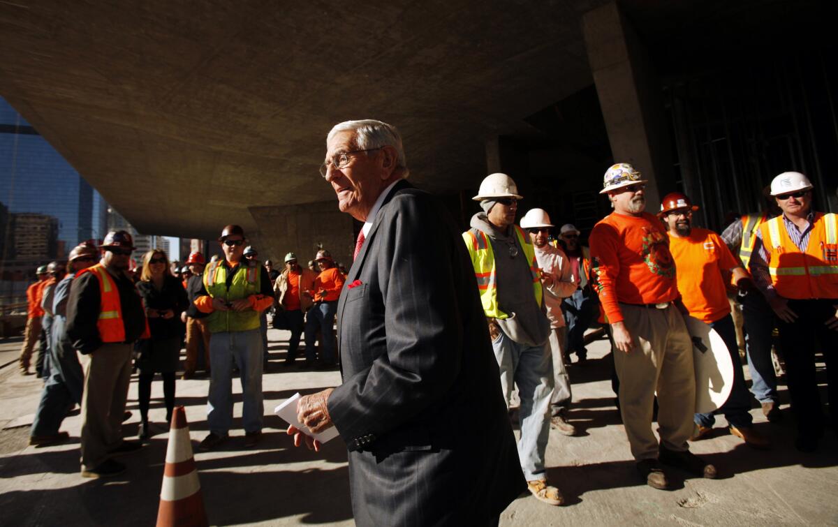 Eli Broad surrounded by construction workers outside the Broad museum 